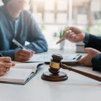 Business people and lawyers talk and contract together. Signing Business people and lawyers talk and contract together. Signing